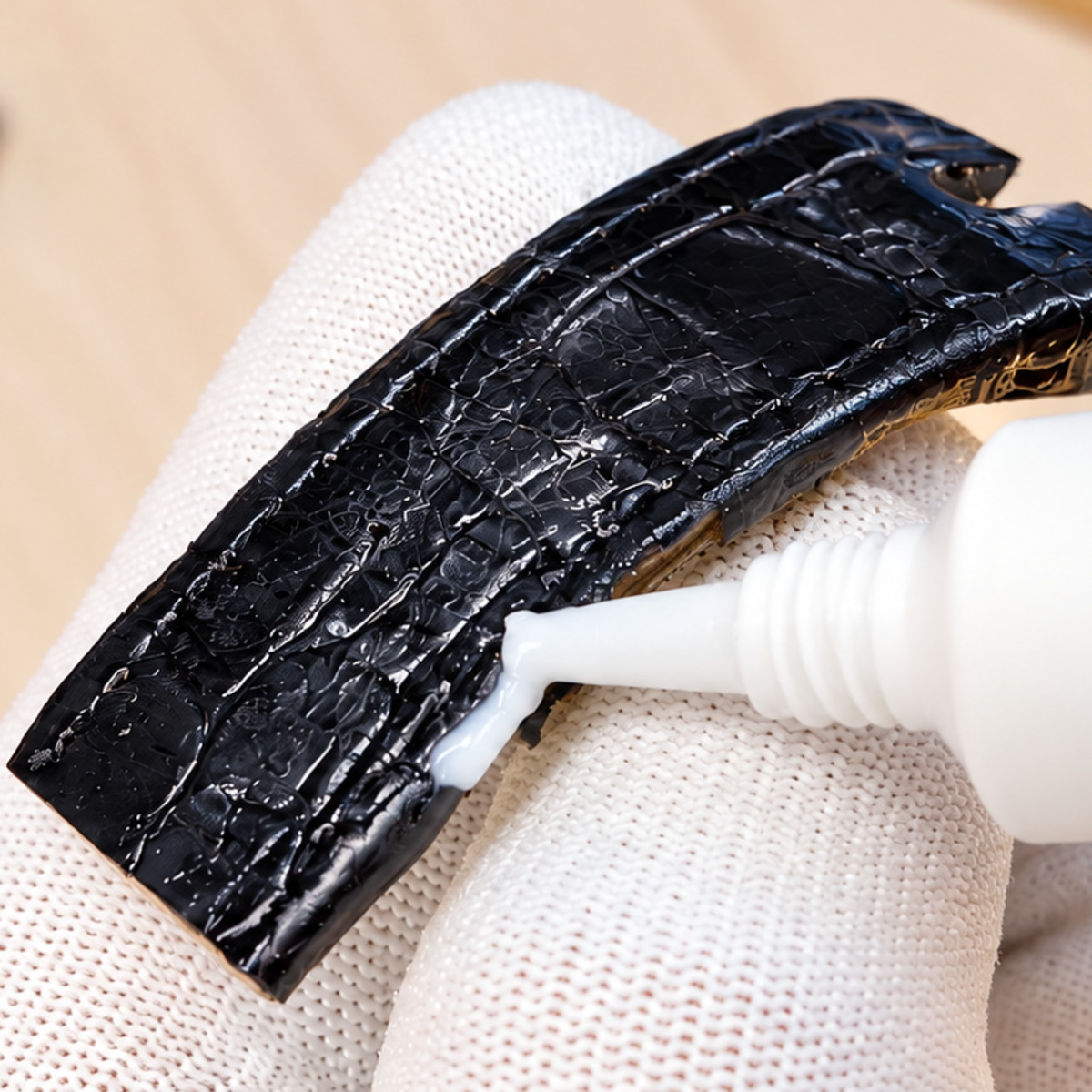 Applying adhesive to the rebuilt strap section.